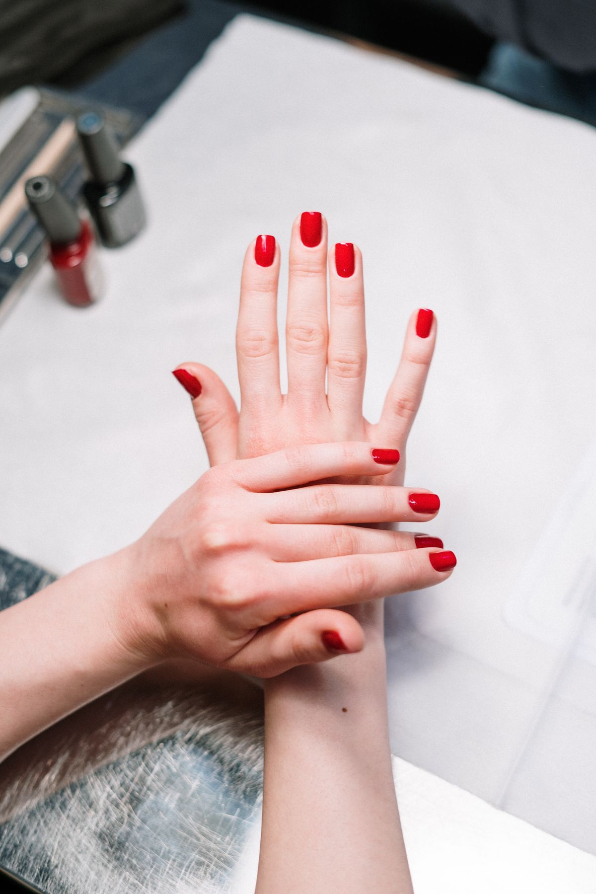 Finished red manicure, representative of services at Angel Nails